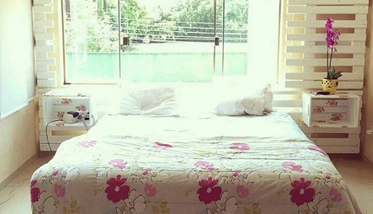 Pallet Bed with Side Table and Wall Decor